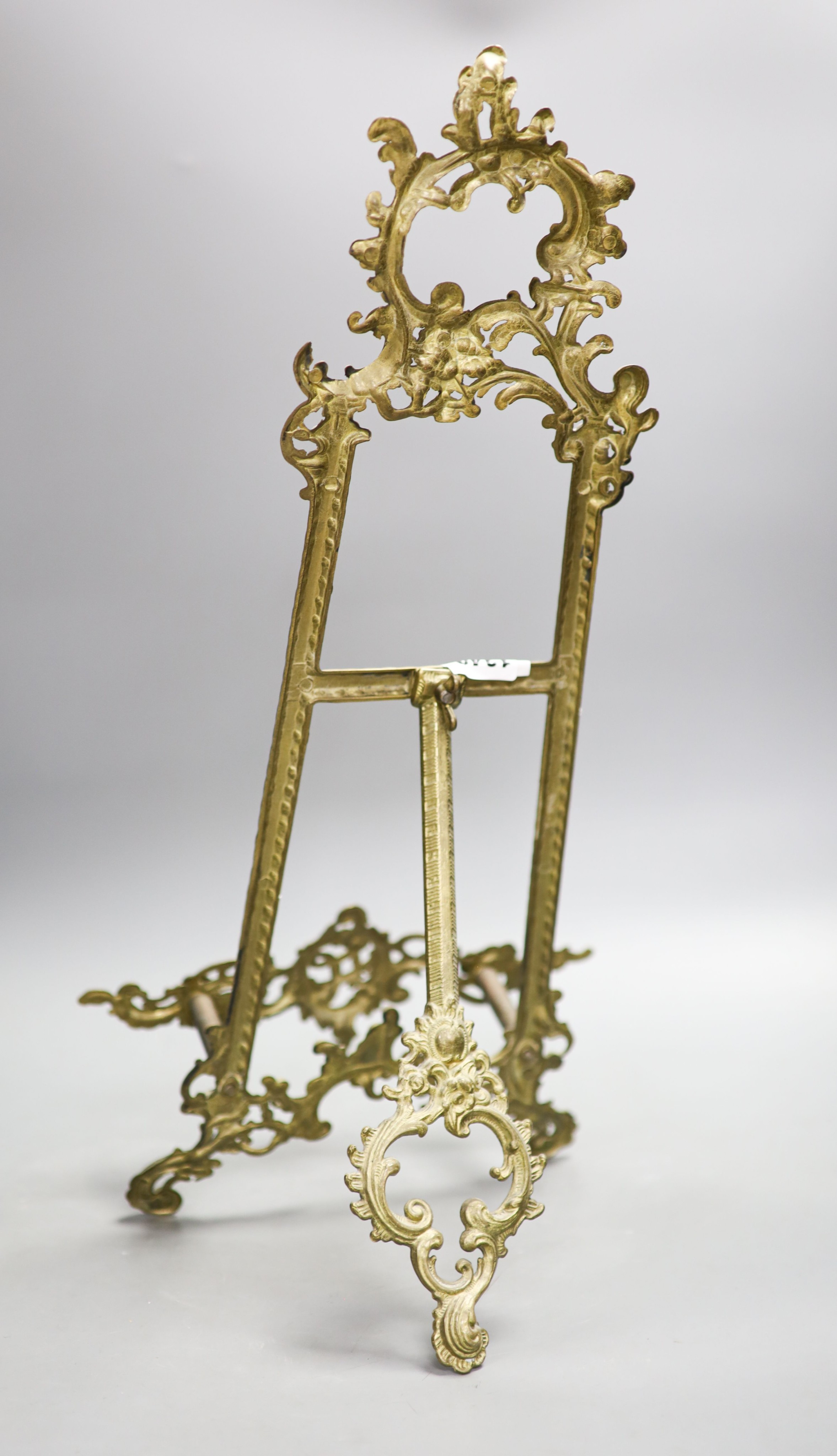 A cast brass easel 55cm